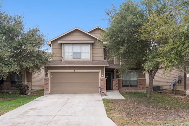 view of front of home featuring a garage and central air condition unit