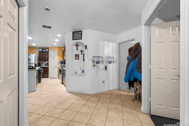 interior space with light tile patterned floors