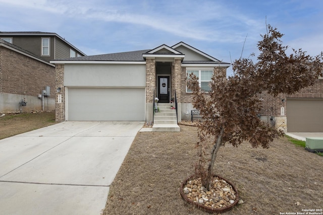 view of front of home featuring a garage and central AC unit