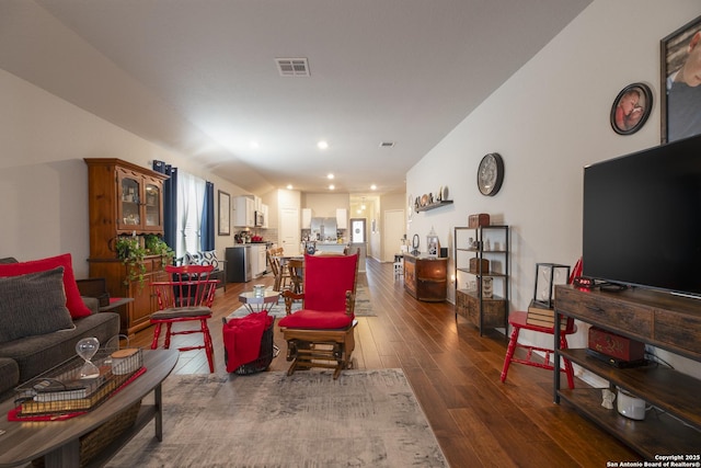 living room with dark hardwood / wood-style flooring