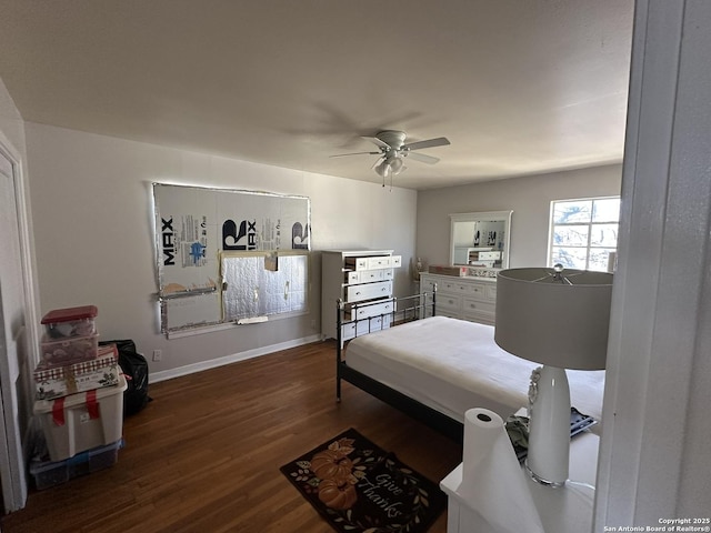 bedroom with ceiling fan and dark hardwood / wood-style flooring