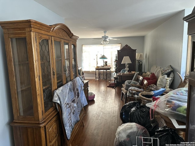 interior space with dark hardwood / wood-style flooring and ceiling fan