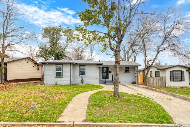 single story home featuring a front yard