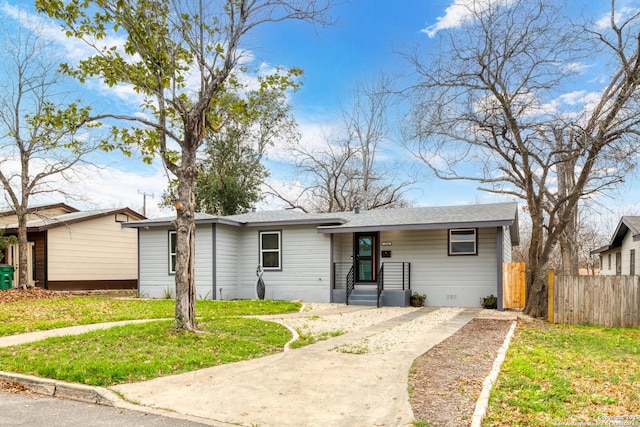 ranch-style home with a front lawn