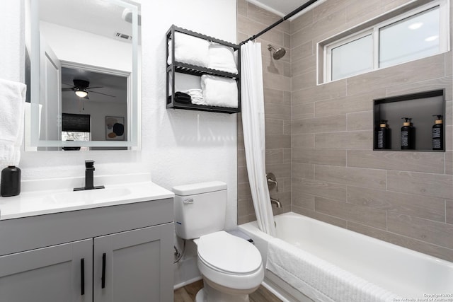 full bathroom with vanity, toilet, and shower / bath combo with shower curtain