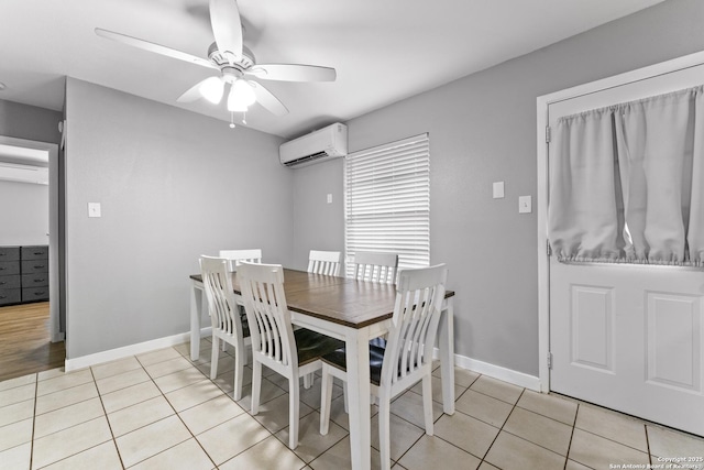 dining space with ceiling fan, light tile patterned floors, and an AC wall unit