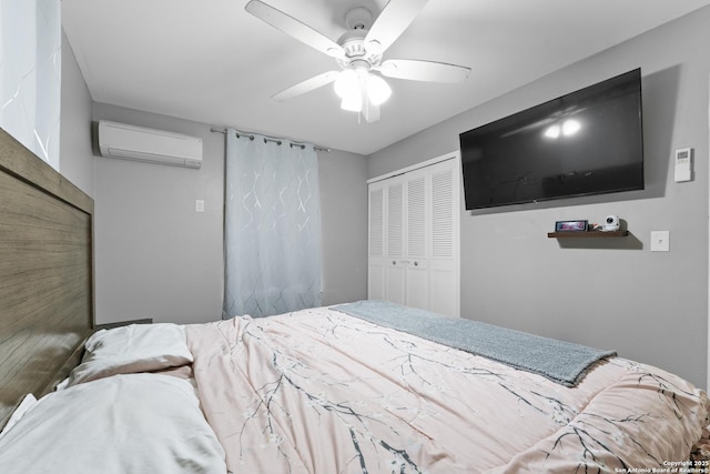 bedroom with ceiling fan, a closet, and a wall mounted AC