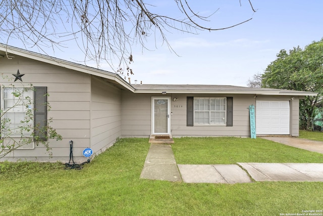 single story home with a garage and a front yard