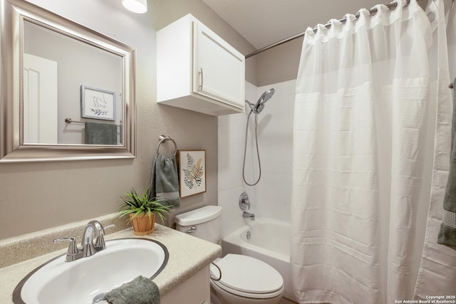 full bathroom featuring sink, shower / tub combo with curtain, and toilet