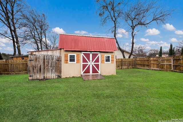 view of outbuilding with a yard