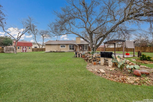 view of yard with a storage unit, a pergola, and a jacuzzi