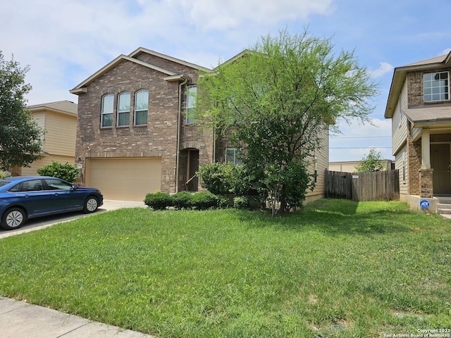 view of front of property featuring a garage and a front lawn