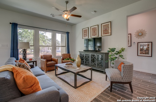 living room featuring ceiling fan