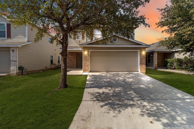 view of front facade featuring a garage and a yard