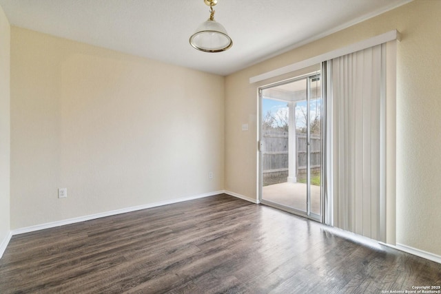 unfurnished room with dark hardwood / wood-style floors