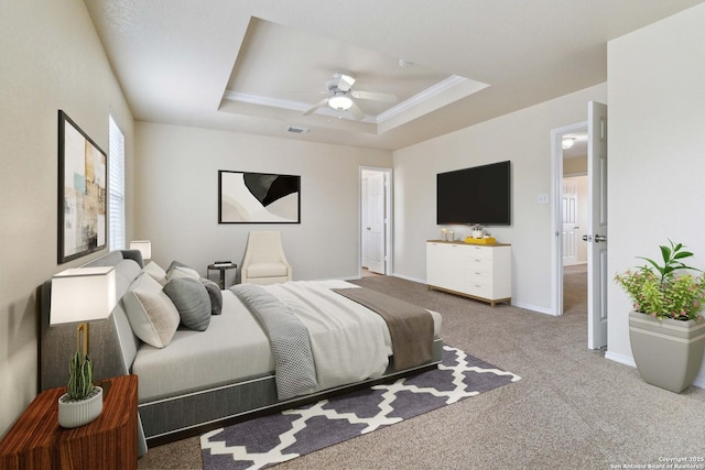 bedroom with crown molding, a tray ceiling, ceiling fan, and carpet flooring