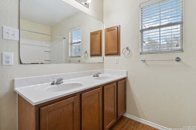 bathroom with vanity and hardwood / wood-style floors