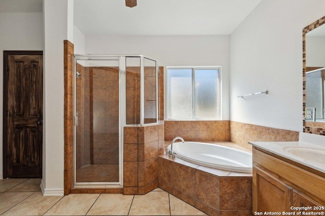 bathroom with tile patterned floors, vanity, and independent shower and bath