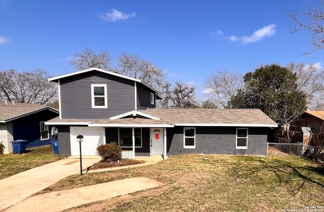 front facade with a garage and a front yard