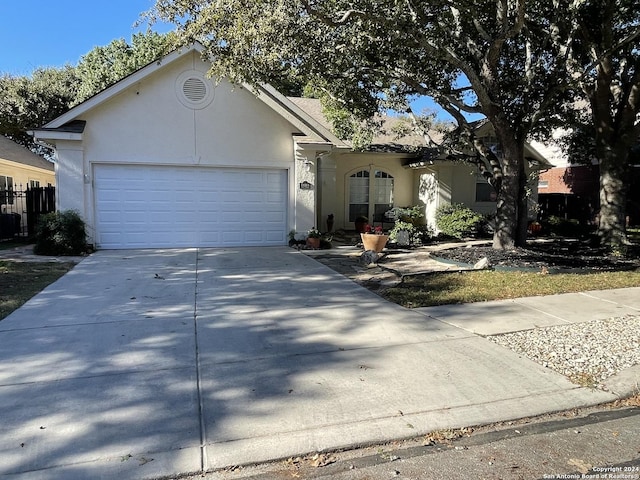 single story home featuring a garage