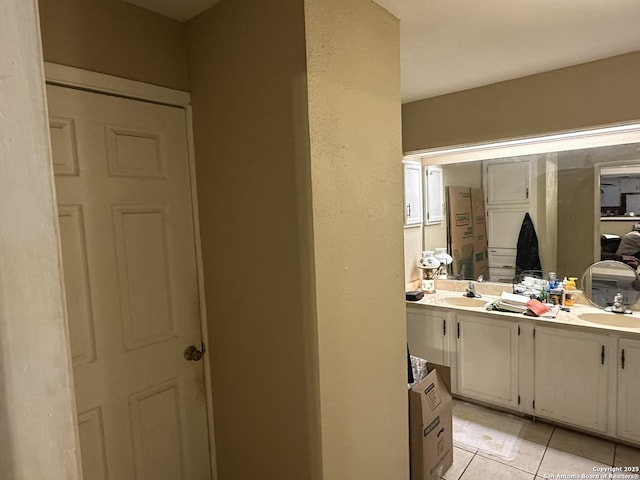 bathroom with tile patterned flooring and vanity