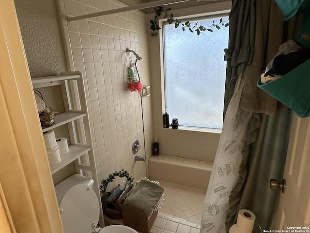 bathroom featuring toilet, tile walls, tile patterned floors, and shower / bath combo with shower curtain