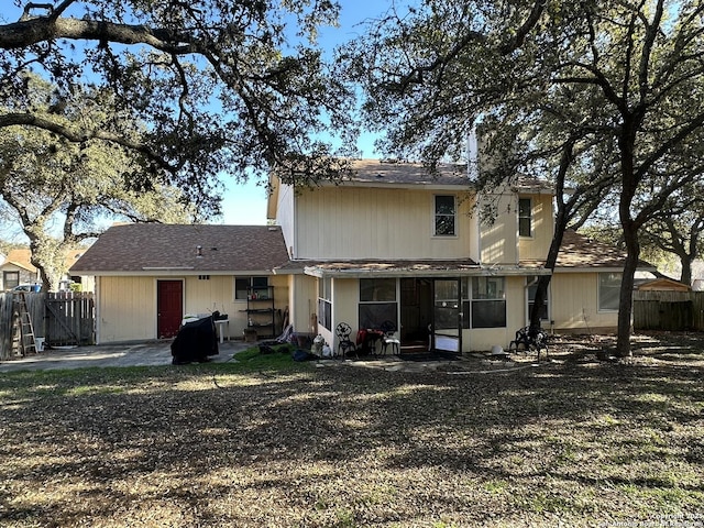 rear view of property featuring a patio