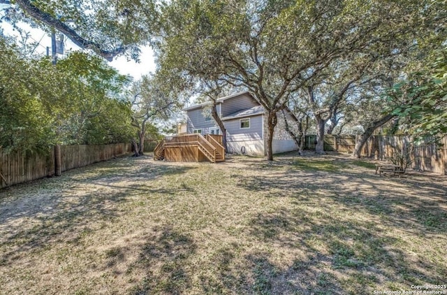 view of yard featuring a wooden deck