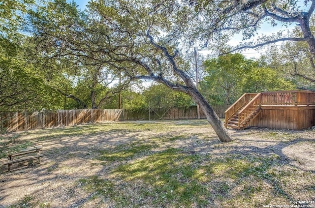 view of yard featuring a wooden deck