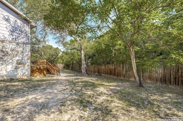 view of yard featuring a wooden deck