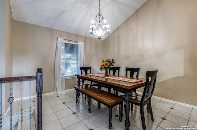 dining area with a chandelier, vaulted ceiling, a textured ceiling, and light tile patterned floors