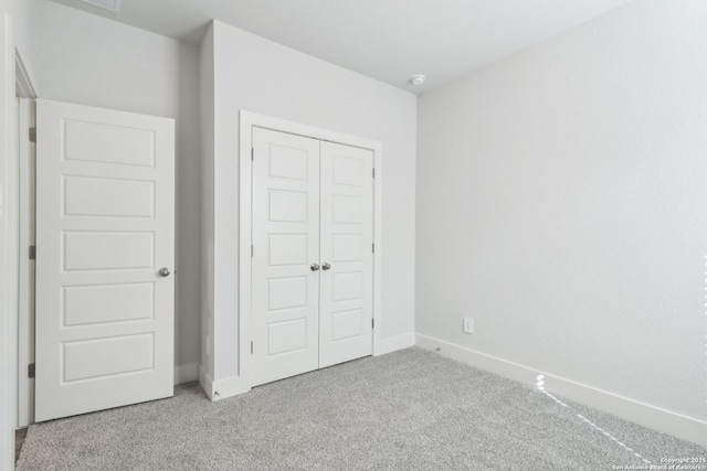 14603 Rainwater Trl, San Antonio, TX 78253 - unfurnished bedroom featuring baseboards, a closet, and carpet flooring