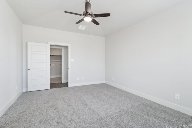 14603 Rainwater Trl, San Antonio, TX 78253 - unfurnished bedroom featuring baseboards, visible vents, carpet floors, and a walk in closet