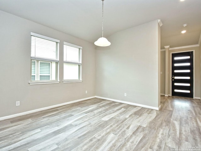 unfurnished room with light hardwood / wood-style flooring