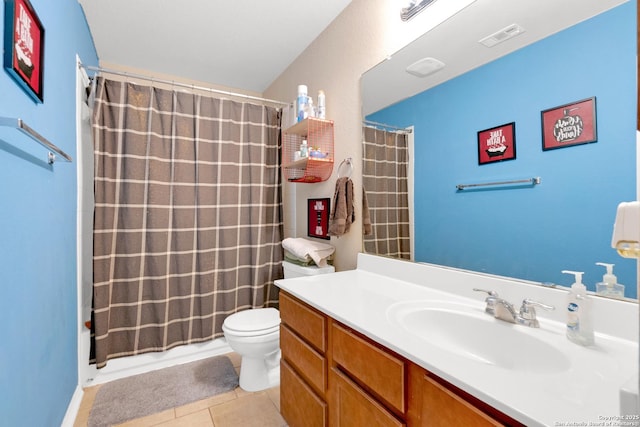 bathroom featuring tile patterned flooring, vanity, a shower with curtain, and toilet