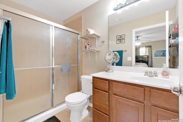 bathroom featuring walk in shower, tile patterned floors, vanity, and toilet