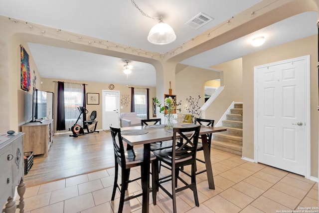 dining area with light tile patterned flooring and a wealth of natural light