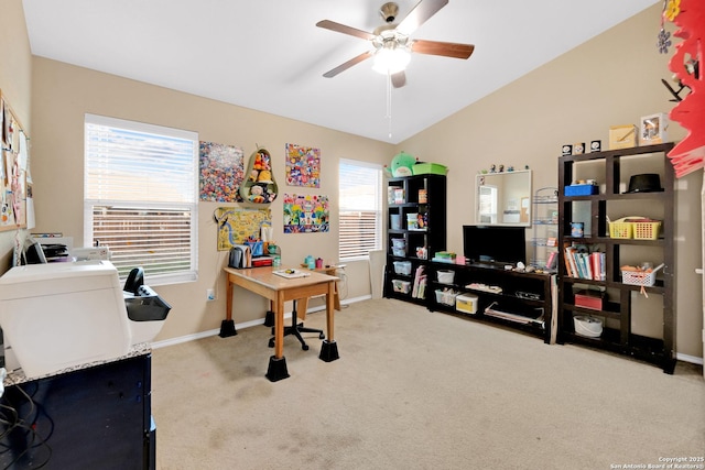 office space with ceiling fan, light colored carpet, and lofted ceiling