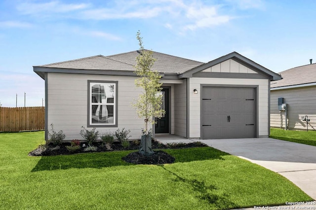 ranch-style house featuring a garage and a front lawn