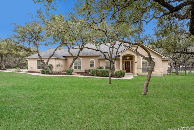 ranch-style home with a front lawn