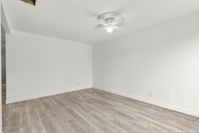 spare room featuring ceiling fan and light hardwood / wood-style flooring