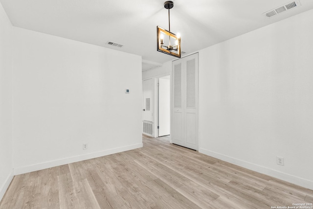 empty room with light hardwood / wood-style floors