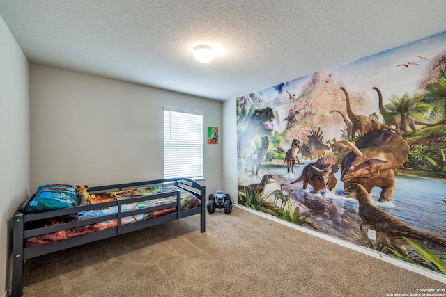 bedroom with carpet flooring and a textured ceiling