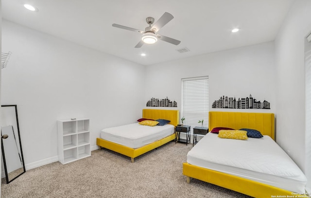 bedroom featuring ceiling fan and carpet