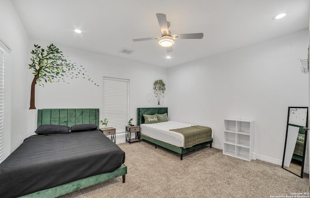 bedroom with ceiling fan and carpet flooring