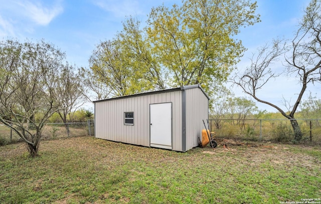 view of outbuilding featuring a yard