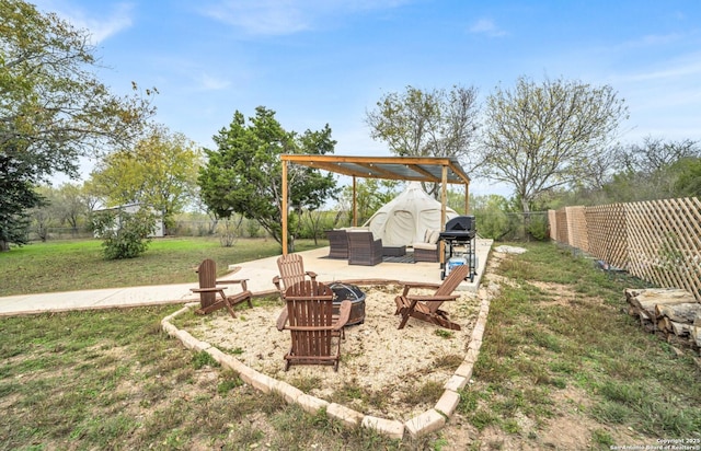 view of yard featuring an outdoor fire pit and a patio