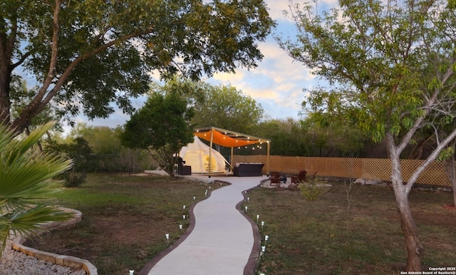 view of yard at dusk