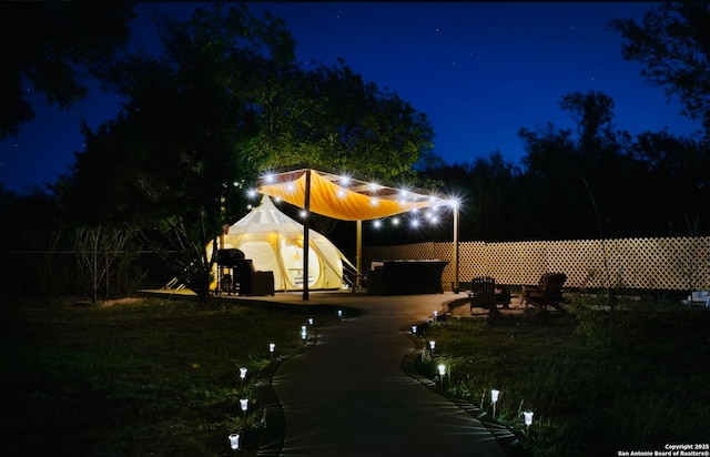 view of yard at night