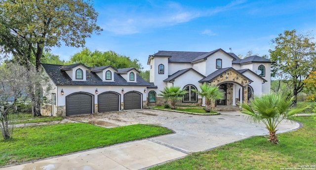 french country inspired facade with a garage and a front yard